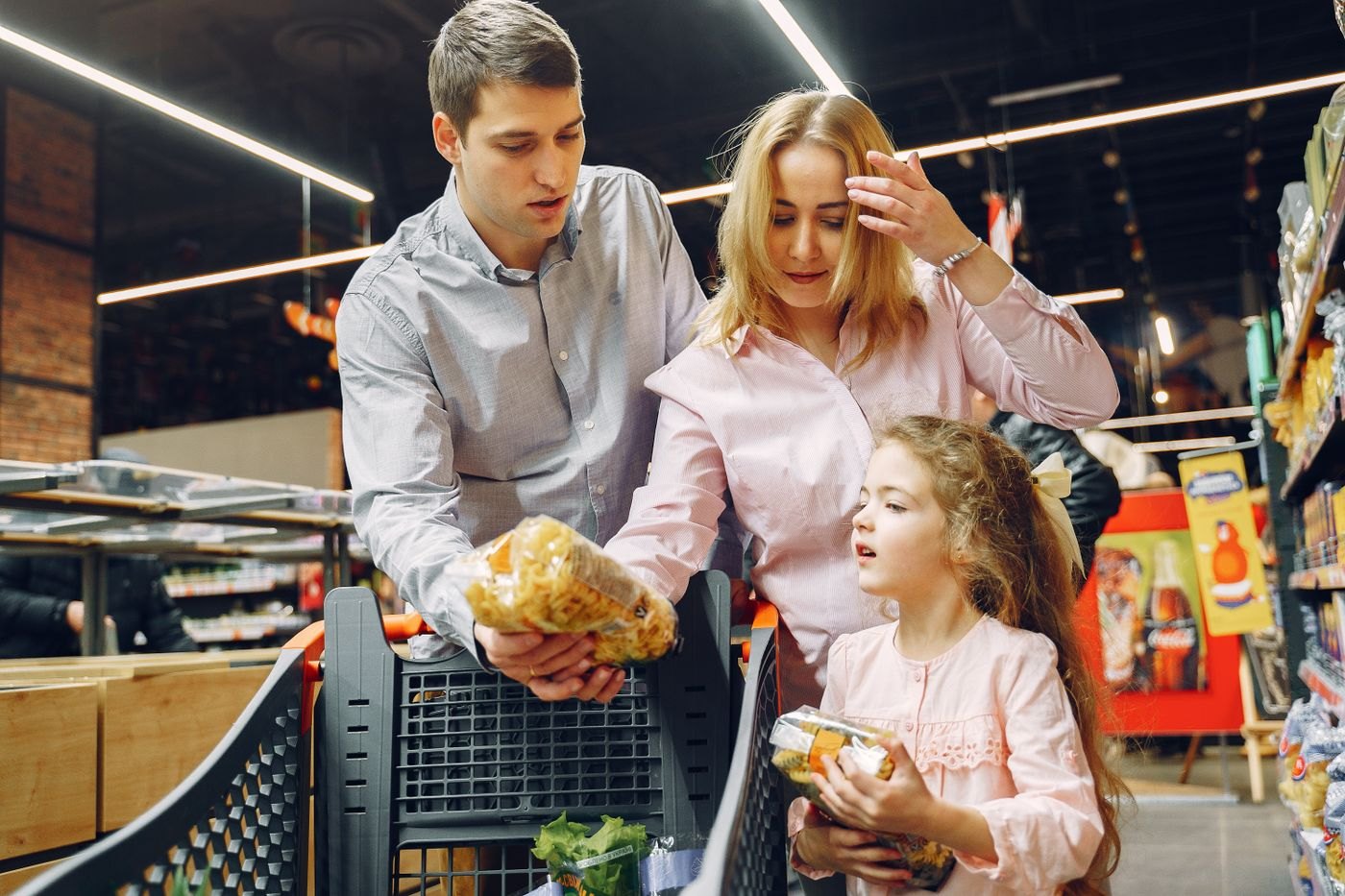 A household selecting groceries in a supermarket