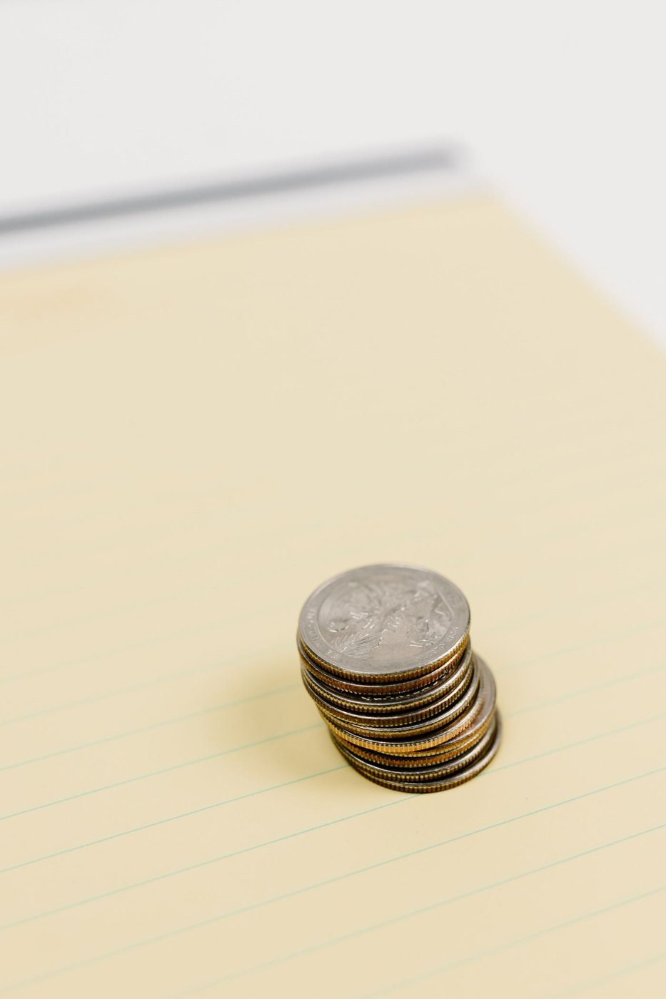 Coins arranged on a yellow sheet