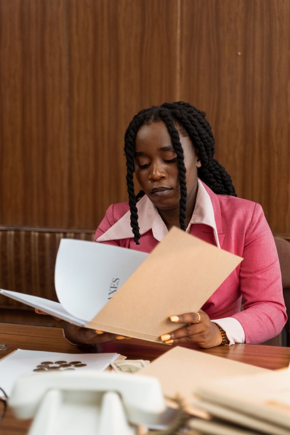 A reader examining a printed document