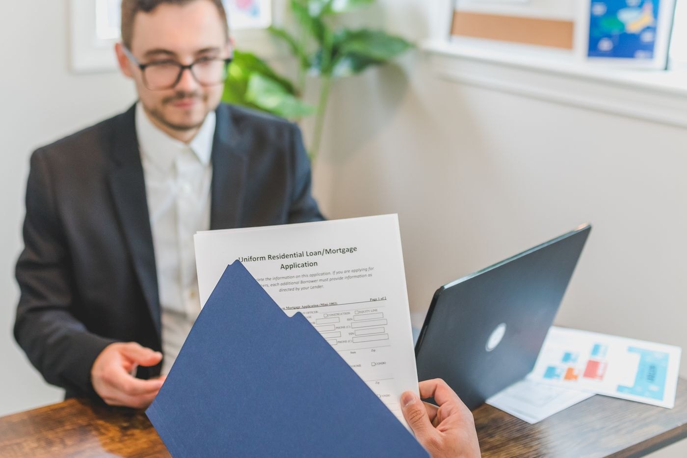 A person reading loan documents