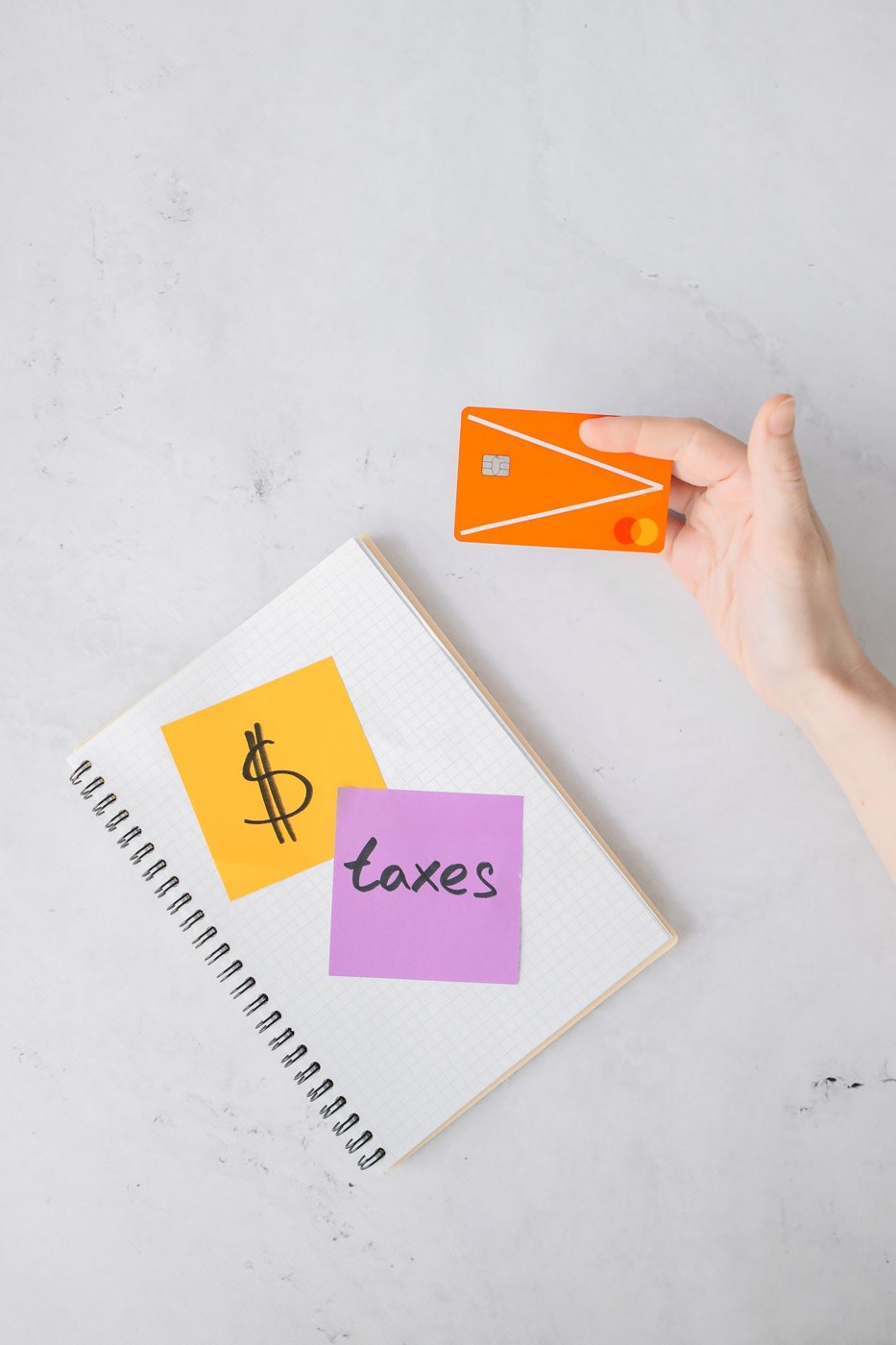 A credit card beside an open notebook