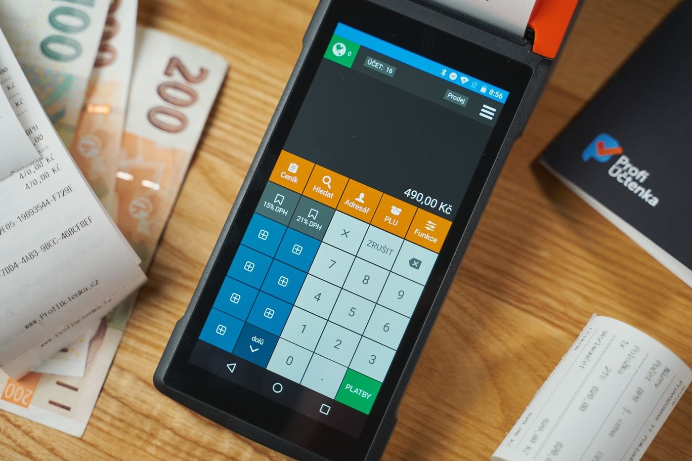 Payment receipts beside a card terminal