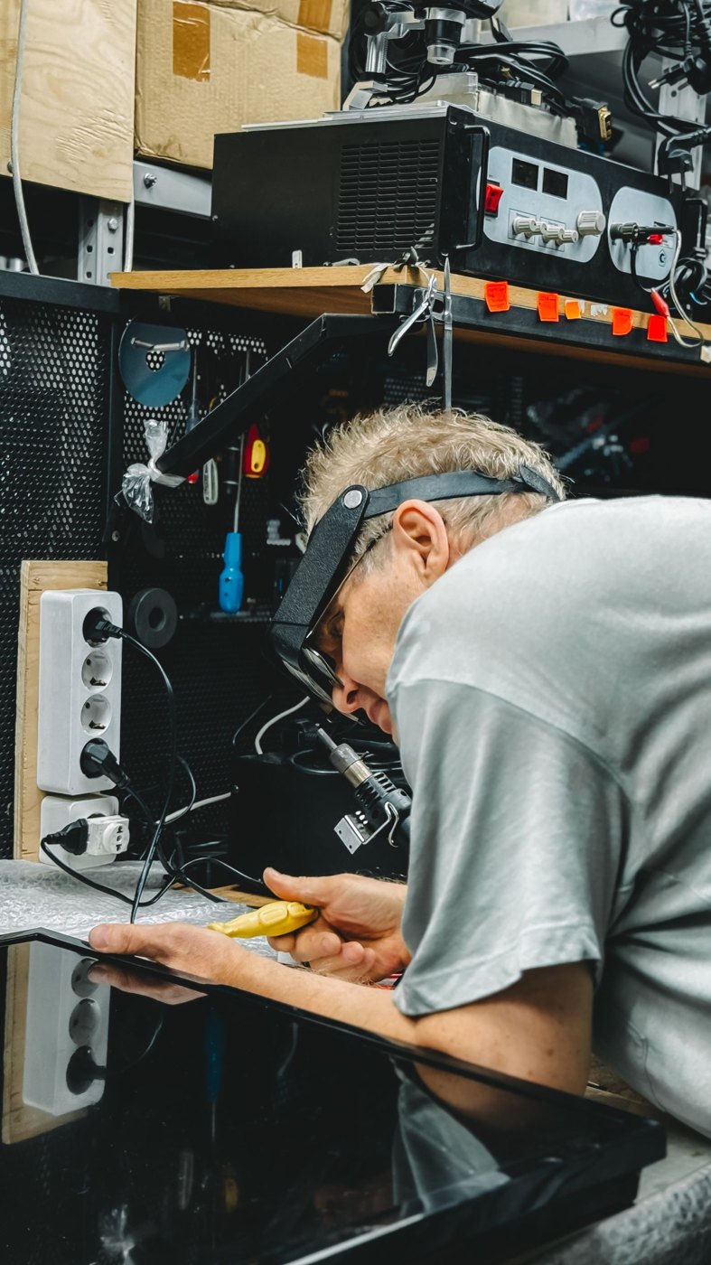 A technician repairing an electronic device