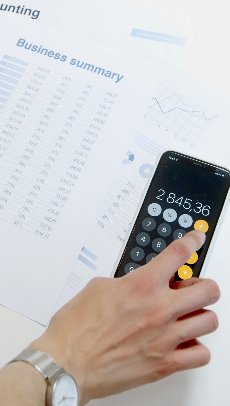 A person using a phone calculator