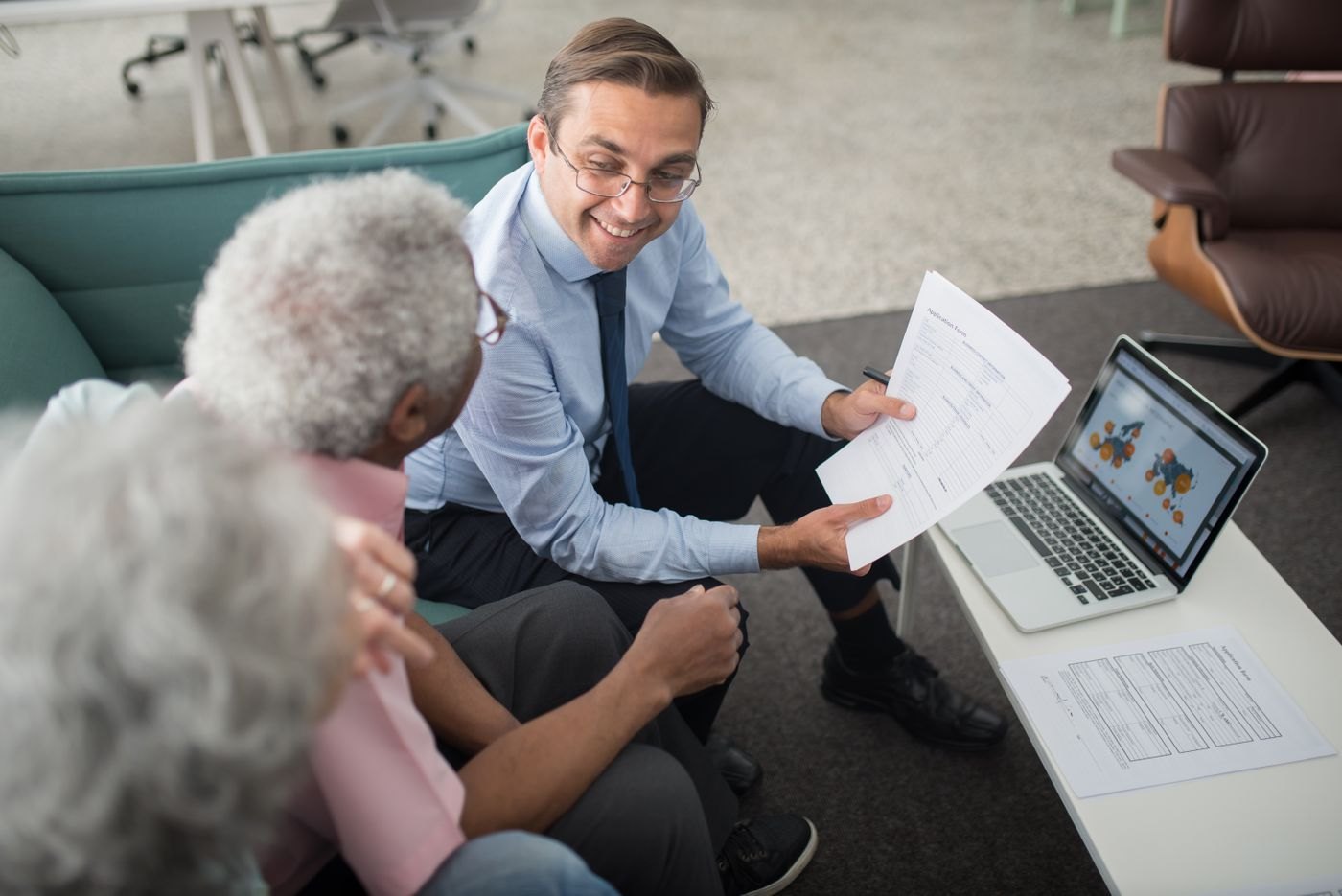 Two people reviewing documents in a consultation